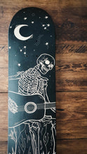 Load image into Gallery viewer, Skeleton Playing Guitar Under the Stars skate deck
